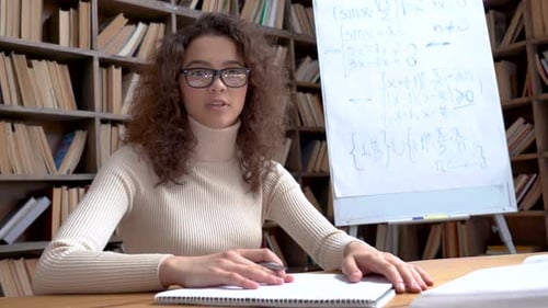 Woman Explaining Math Concepts for Online Education