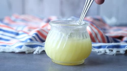 Homemade Ghee in Container on a Table
