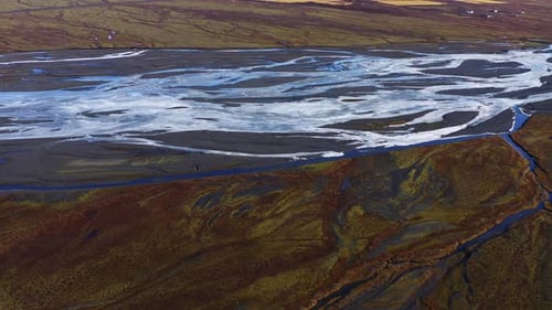 Aerial View of a River Curves and Mudflows From Glacier in Iceland