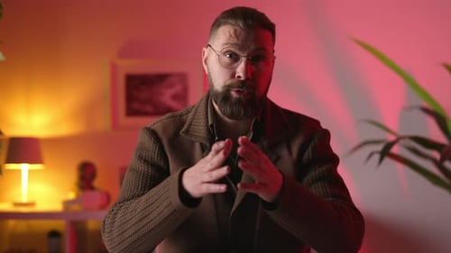 Man with Beard Talks Directly to Camera