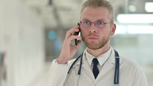 Professional Doctor Using Smartphone in Hospital Setting