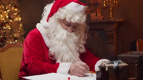 Santa Claus Writes Letters in Cozy Christmas Setting