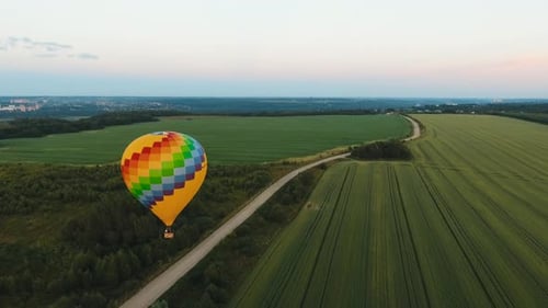 Hot Air Balloon in the Sky Over a Field