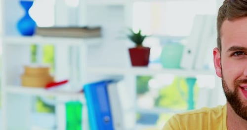 Man Smiling in Bright Office, Close Up