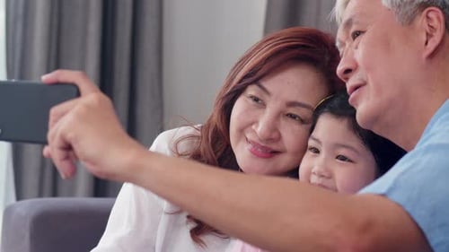 Grandparents and Grandchild Taking a Selfie