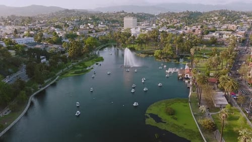 Aerial Shot of Echo Park Lake on Sunny Day in Los Angeles, Drone Over Fountain and White Swan Boats