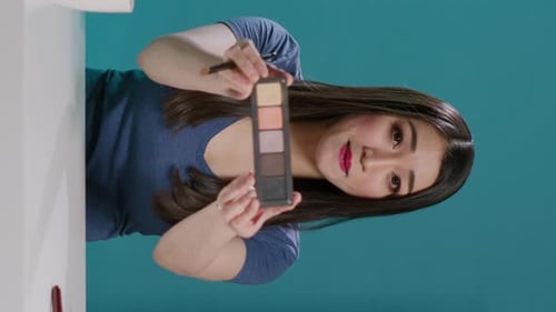 Vertical Video POV of Influencer Filming Makeup Tutorial with Eyeshadow Palette
