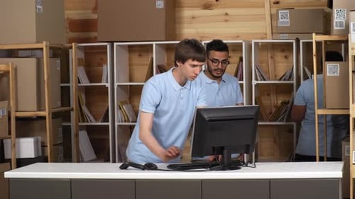 Three Diverse Post Office Clerks Working Together behind Counter