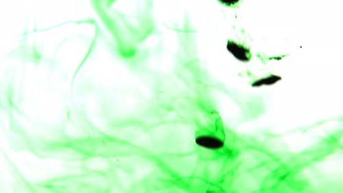 Green ink drops in water