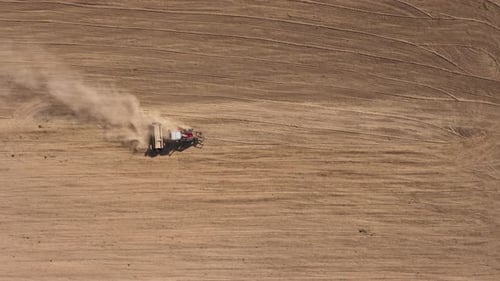 Tractor Tilling Field Aerial View