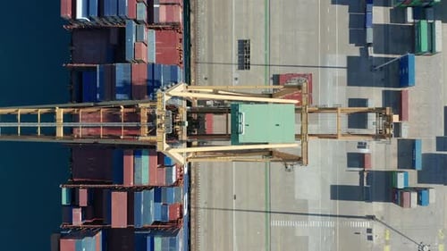 Aerial View. International Port with Crane Loading Containers in Import Export Business Logistics.