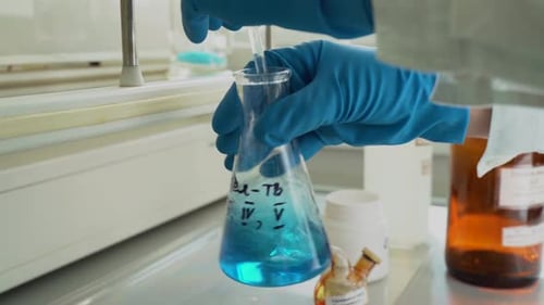 Mixing Colorful Chemicals in a Laboratory Flask