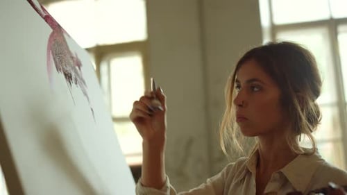 Woman Painting on Canvas in Art Studio