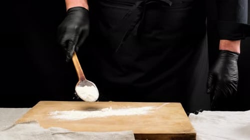 Chef Preparing Flour on a Cutting Board
