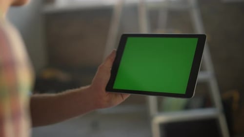 Man Hand Holding Tablet Indoors