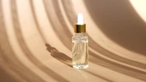 Serum Bottle with Calming Shadows and Elegant Style
