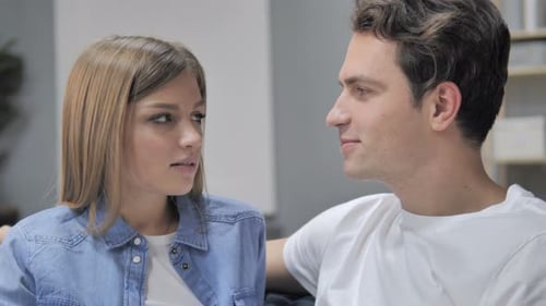 Close Up of Talking Young Couple Discussing and Sharing Information