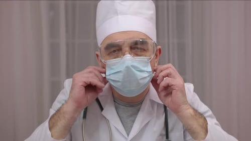 Extreme Close Up Portrait of Doctor Wearing Protective Medical Mask