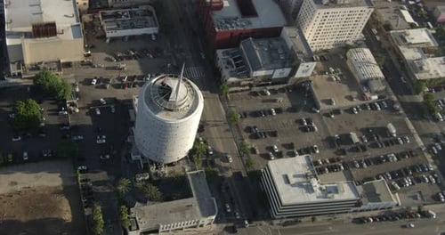 Helicopter aerial that moves forward on an angle over freeway, day