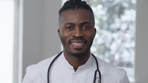Doctor Smiling Wearing Stethoscope and White Coat