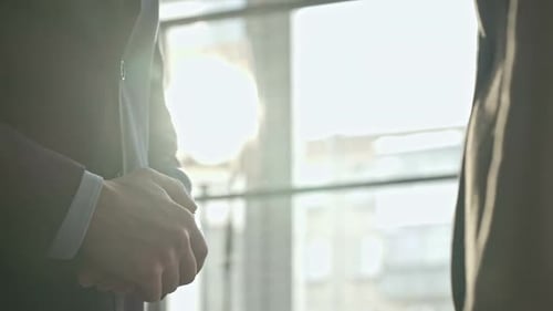 Business Handshake in Bright Office Sunlight
