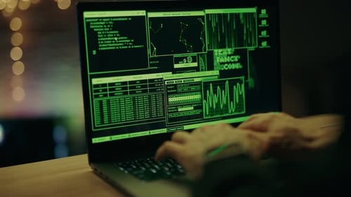 Hacker is Working on Laptop at Night