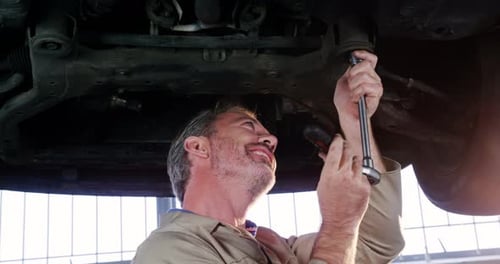 Mechanic servicing a car