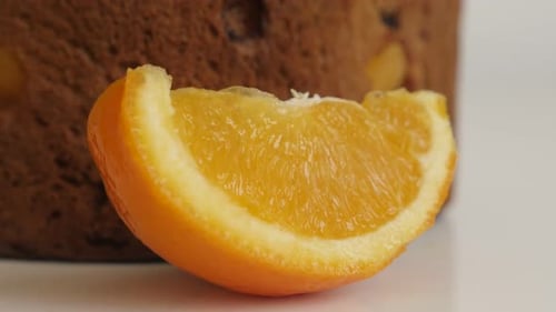Panettone cake sliced orange 4K slow tilt footage