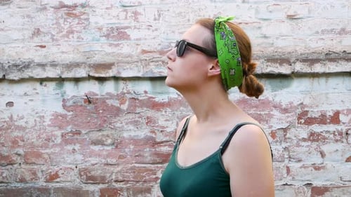 Woman with Allergy Blows Nose Outside