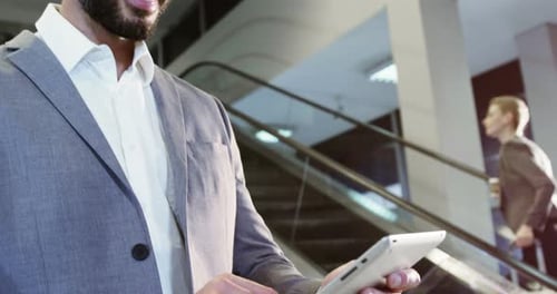 Man Using Tablet in Modern Urban Setting