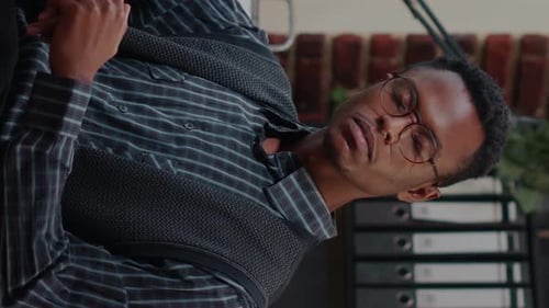 Young Man Presenting in a Modern Office