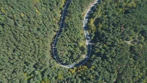 Aerial View of Transportation Van and Cars Driving Along Big Road Turn on Asphalt Mountain Road in
