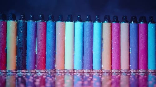 Row of Colorful Disposable Vape Pens Lined Up