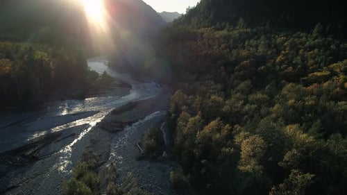Aerial Nature Background Of Mountain River At Sunset