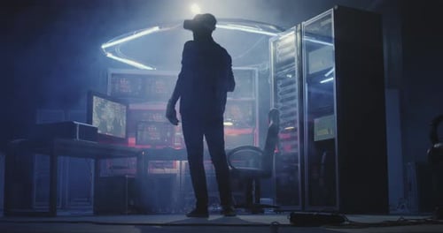 Man Using VR Headset in Dark Server Room