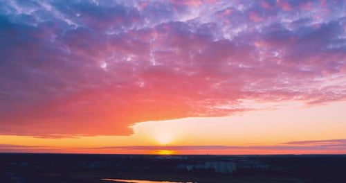 Colorful Sunrise Over City and Skyline