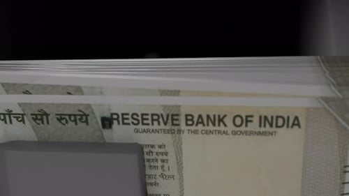 500 Indian rupees in cash dispenser. Withdrawal of cash from an ATM.
