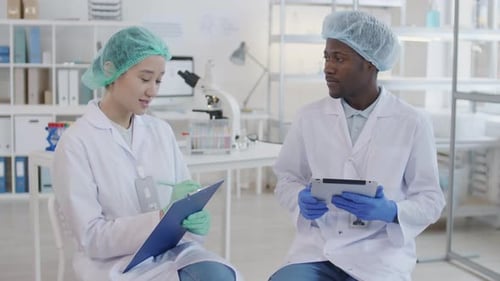 Medical Professionals Discussing Results in Lab Environment
