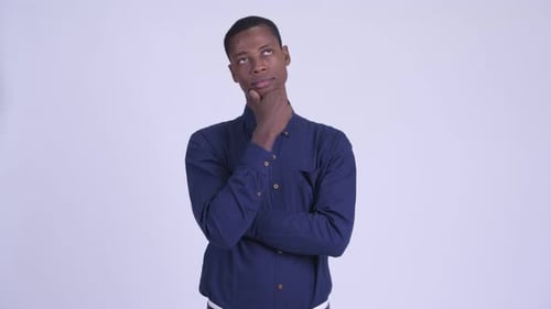 Young Man Thinking with Hand on Chin
