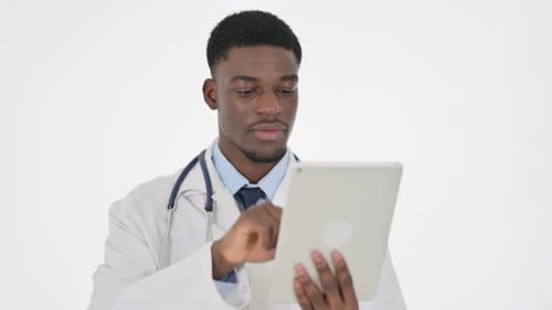 Medical Professional Using Tablet in Bright Studio