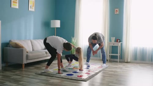 Parents Play Twister with Daughter