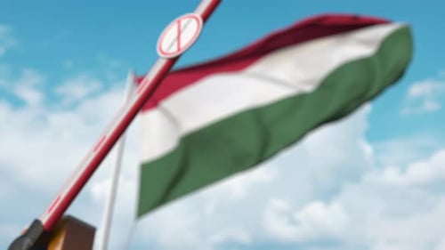 Hungarian Border Security Barrier with Coronavirus Restriction Sign