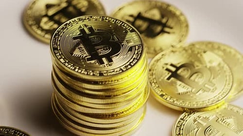 Rotating shot of Bitcoins (digital cryptocurrency) - BITCOIN