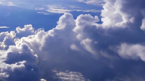 Fluffy White Clouds Against a Deep Blue Sky