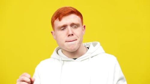 Young Adult Man Talking in White Hoodie