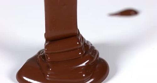 Chocolate Flowing on White Background, Slow Motion 4K