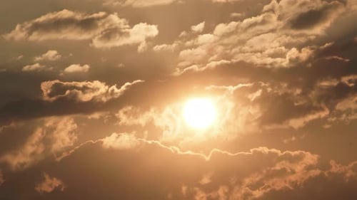 Sun Shines Through Clouds at Sunrise