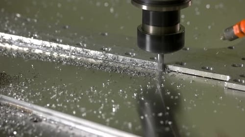 CNC Mill Cutting Metal Sheet Close Up