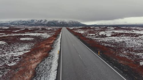Straight road in cold valley