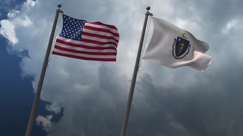 American and Massachusetts Flags Waving in Cloudy Sky